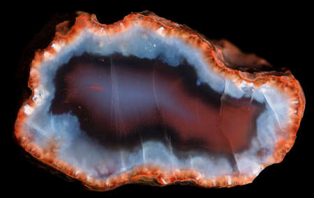Slice of Geode with red and blue chalcedony and red zeolite crystals on the periphery. Russia, Kemerovo regionの写真素材