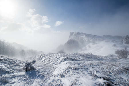 Snowstorm in the winter mountainsの写真素材