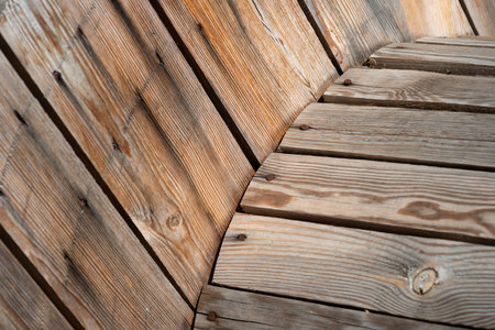 Abstract wooden background-fragment of an old cable reel with rusty nails, selective focusの写真素材