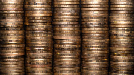 Full-screen background of stacks of abstract yellow brass coins