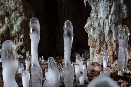 A group of ice stalagmites in a frozen winter caveの写真素材