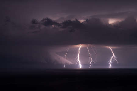 Multiple lightning bolts during a thunderstorm over the Black sea.の写真素材