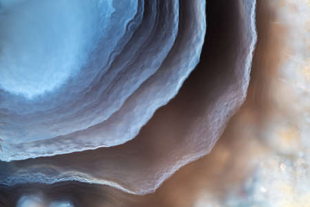 Close-up full-screen texture - fragment of blue layered agate.の写真素材