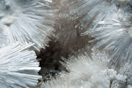 Macro view of transparent acicular crystals of natrolite inside a geode with a selective focus.の写真素材
