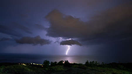 Lightning during a night thunderstorm over the Black Sea, horizontal, panoramic.の写真素材