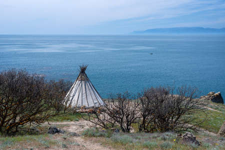 Teepee or wigwam on the wild sea coast in early spring.の写真素材