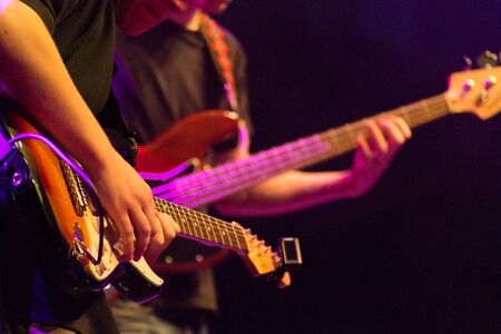 Two guitar players on stageの写真素材