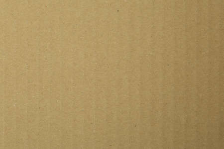 Corrugated cardboard box with vertically running line structure photographed in top viewの写真素材