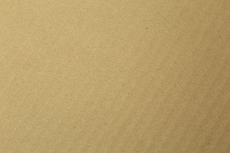 Corrugated cardboard with diagonal line structure photographed in top viewの写真素材