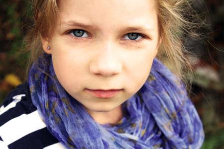 Serious-minded young female child portrait の写真素材