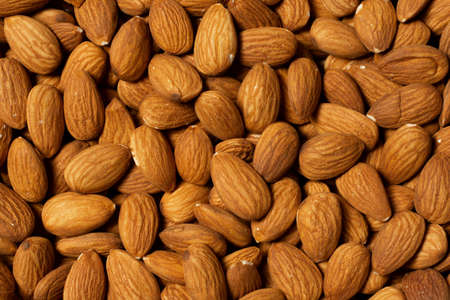Close up view background of natural almond nuts