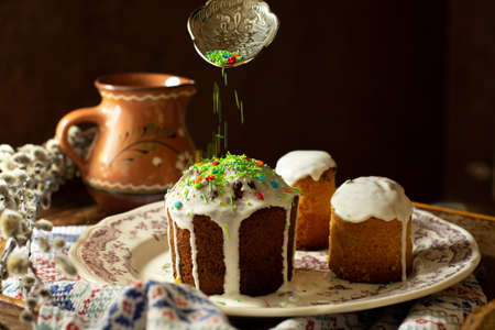 Orthodox traditional cooking of cakes with icing for Easter celebration