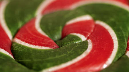 Macro view of green and red Christmas style lollipop candy.の写真素材