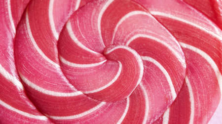 Macro view of red and pink spiral candy lollipop in valentine colors.の写真素材