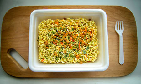 Chinese noodles with spices on a wooden backgroundの写真素材