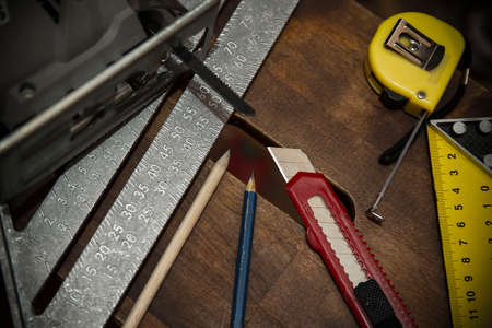 Working tools of measurement on oaken wooden board construction conceptの写真素材