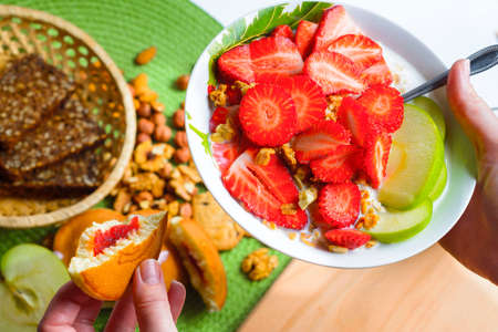 Vegetarian breakfast. Corn flakes with fresh berries and applesの写真素材