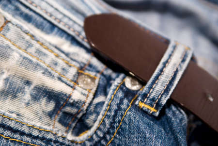 Blue jeans trousers with a brown leather beltの写真素材