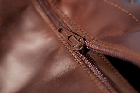 Zipper of a brown leather shoe