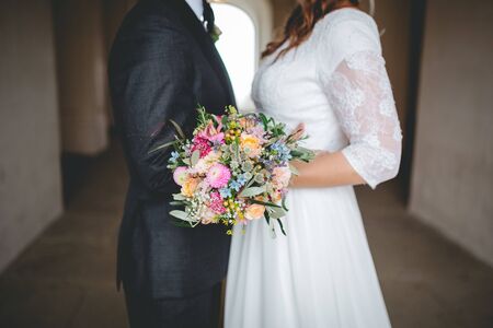 Bride holding flower bouquet close upの写真素材