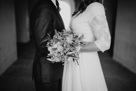 Bride holding flower bouquet close upの写真素材