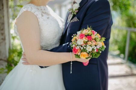 Bride holding flower bouquet close upの写真素材