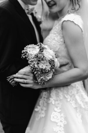 Bride holding flower bouquet close upの写真素材