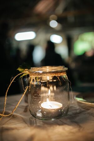 Candle in a glas at a weddingの写真素材