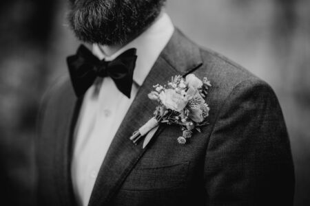 Boutonniere, groom wearing flowers on his jacketの写真素材