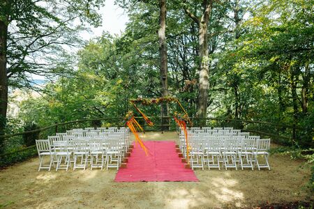Beautiful wedding location outside surrounded by treesの写真素材