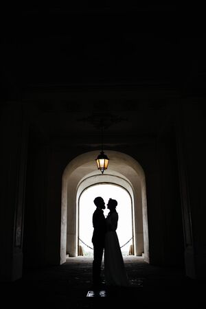 Bride and groom standing togetherの写真素材