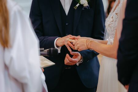 Bride and groom exchanging ringsの写真素材