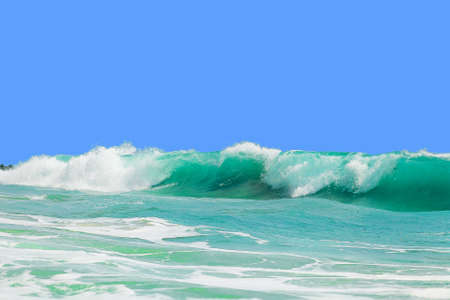 Beautiful big waves near the islandの写真素材