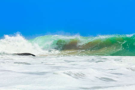 Beautiful waves by the shore of the islandの写真素材