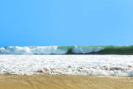 Beautiful waves by the shore of the islandの写真素材