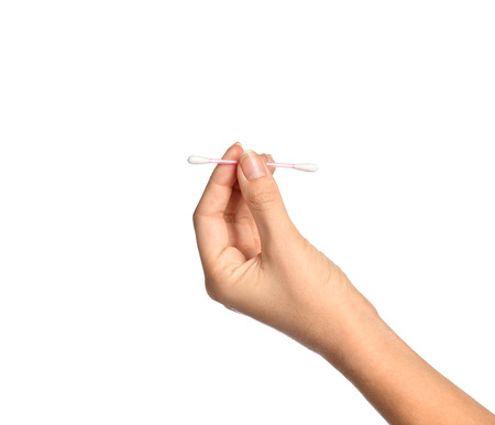 Woman hand hold ear stick isolated on a white backgroundの写真素材