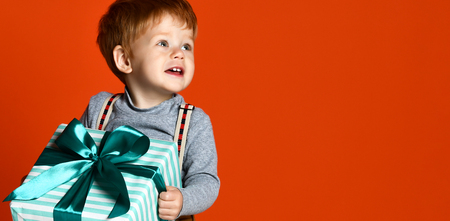 bright picture of happy child with gift boxの写真素材