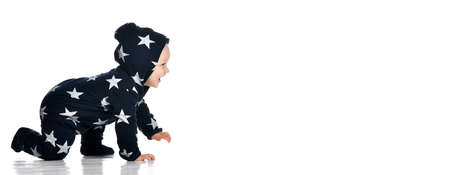 Lovely boy isolated on white background, sweet little baby wearing blue hoodie with stars crawling, happy childhood conceptionの写真素材