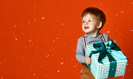 bright picture of happy child with gift boxの写真素材