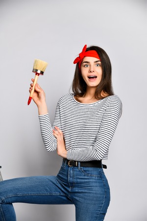 Portrait of a female artist with a wide brush.の写真素材