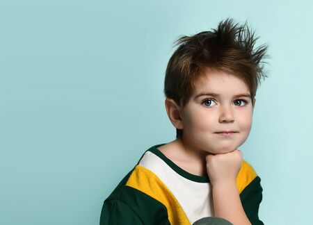 Portrait of happy joyful beautiful little boy, studio shot