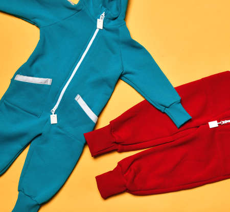 Fabric children fleece tracksuit store assortment on tableの写真素材