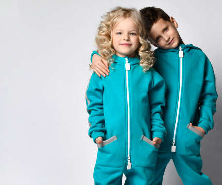 Fashion stylish children, boy and girl studio portraitの写真素材