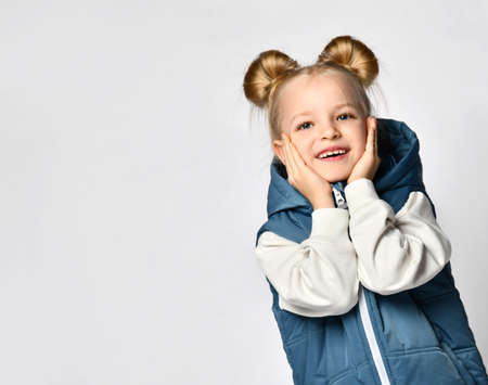 Girl wearing casual outwear sleeveless vest studio shotの写真素材