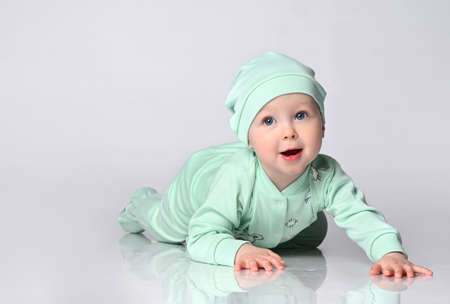 side view of pretty crawling babyの写真素材