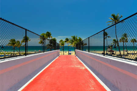 Sunrise Beach in Ft Lauderdale with palm trees and beach entry feature の写真素材