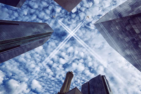 Wide angle shot of downtown Los Angeles with cloudy sky and airplanes の写真素材
