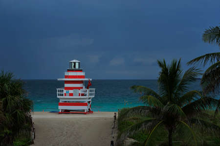 Tropical beach twilight with dramatic sky and blue waters at Miami South Beach, Florida, United Statesの写真素材