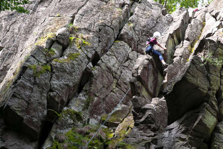 Do Hessians climb on the stone {brick} wall, Germany, Rhön のeditorial素材