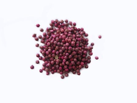 Top view of asian pink coriander seeds on white isolated background preparing for seedingの写真素材